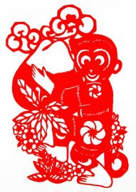 Paper-cut artwork - a monkey holding a peach indicates the longevity of the senior.